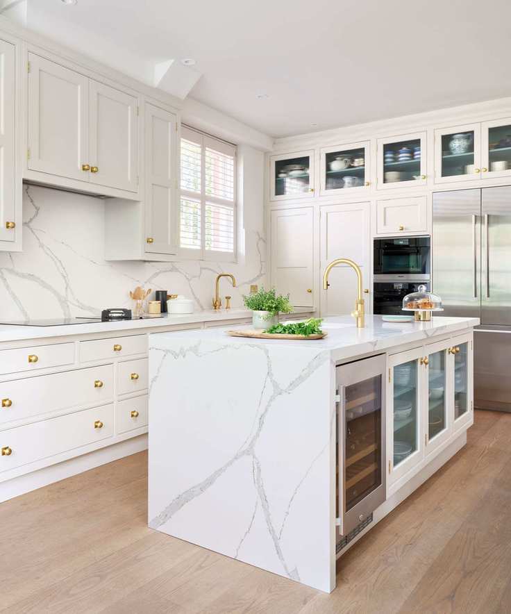 white kitchen with wood flooring