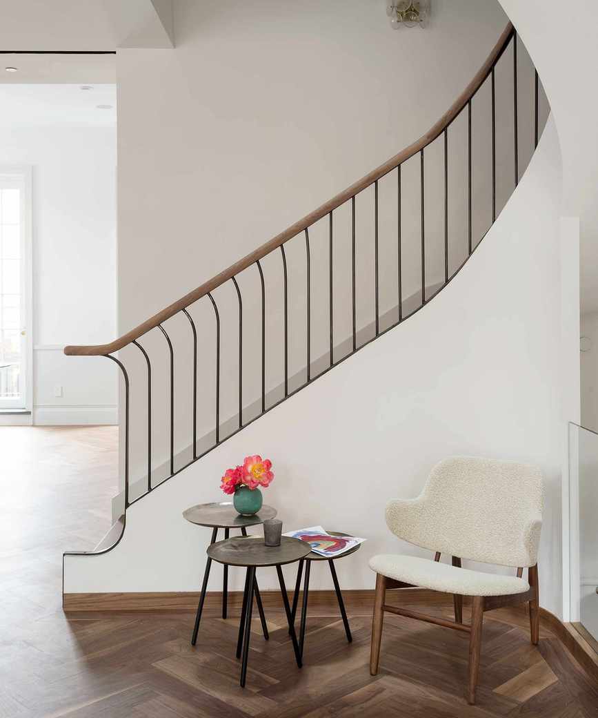 Entryway showcasing white walls and dark wooden flooring