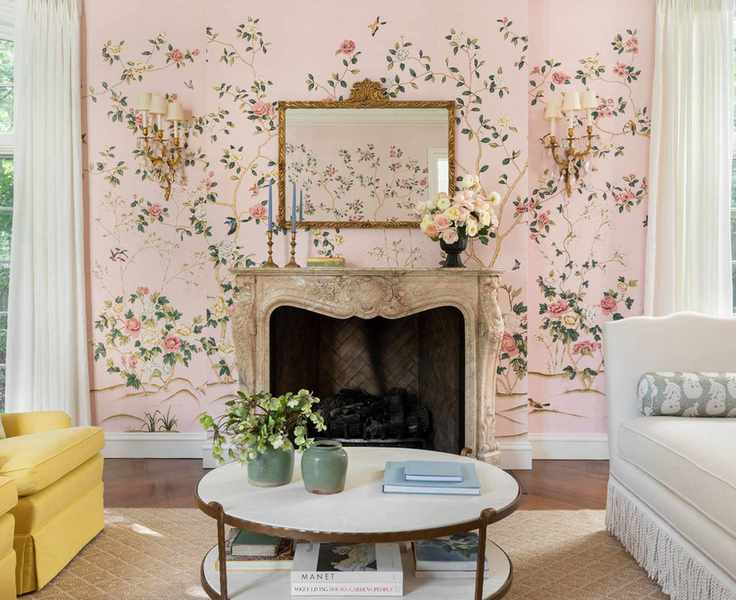 Pretty pink living room with floral wallpaper, decorated fireplace