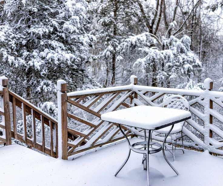 snowy patio and outdoor furniture