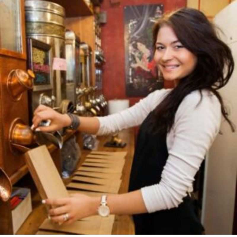 kathryn Henris by a coffee machine
