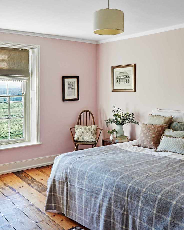 Bright pink bedroom with countryside view