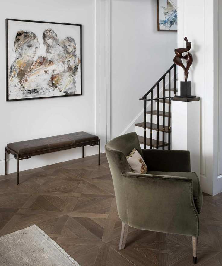 A modern hallway with a minimalistic entryway bench