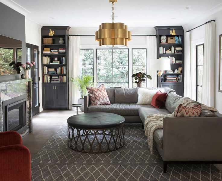 Living room with large pendant, round coffee table and l sofa