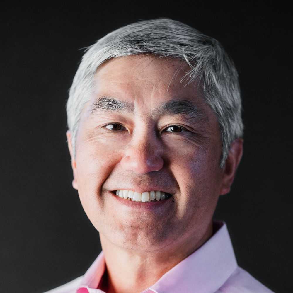 A headshot of Clement Feng against a black background
