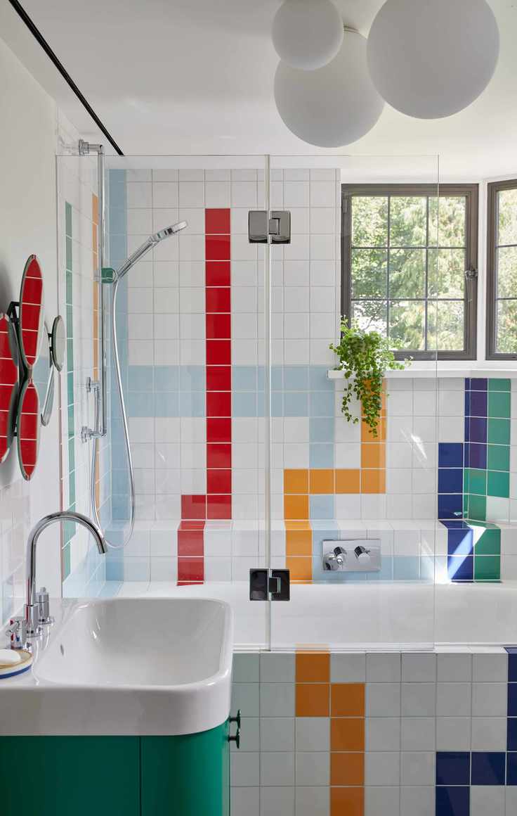 Colorful tiles, green sink base, white ball lights