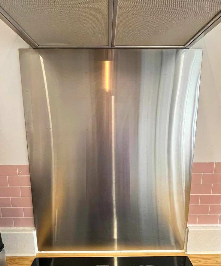 My stainless steel backsplash after cleaning it with my essential oil cleaning spray. It is spotless and has no streaks