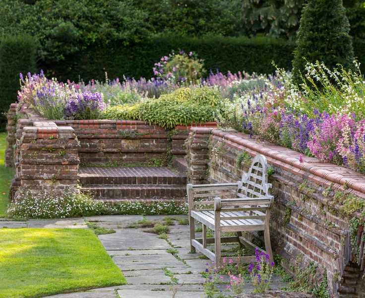 lutyens bench in arts and crafts gardens of Goddards National Trust