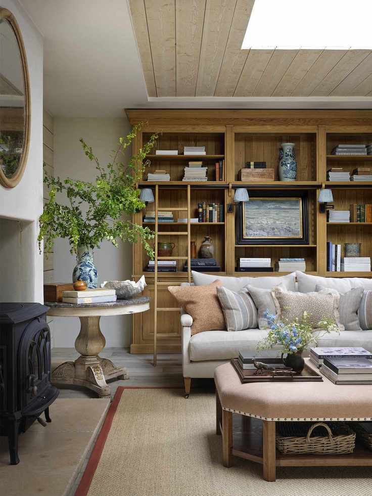 living room with wooden bookshelf ladder and lighting