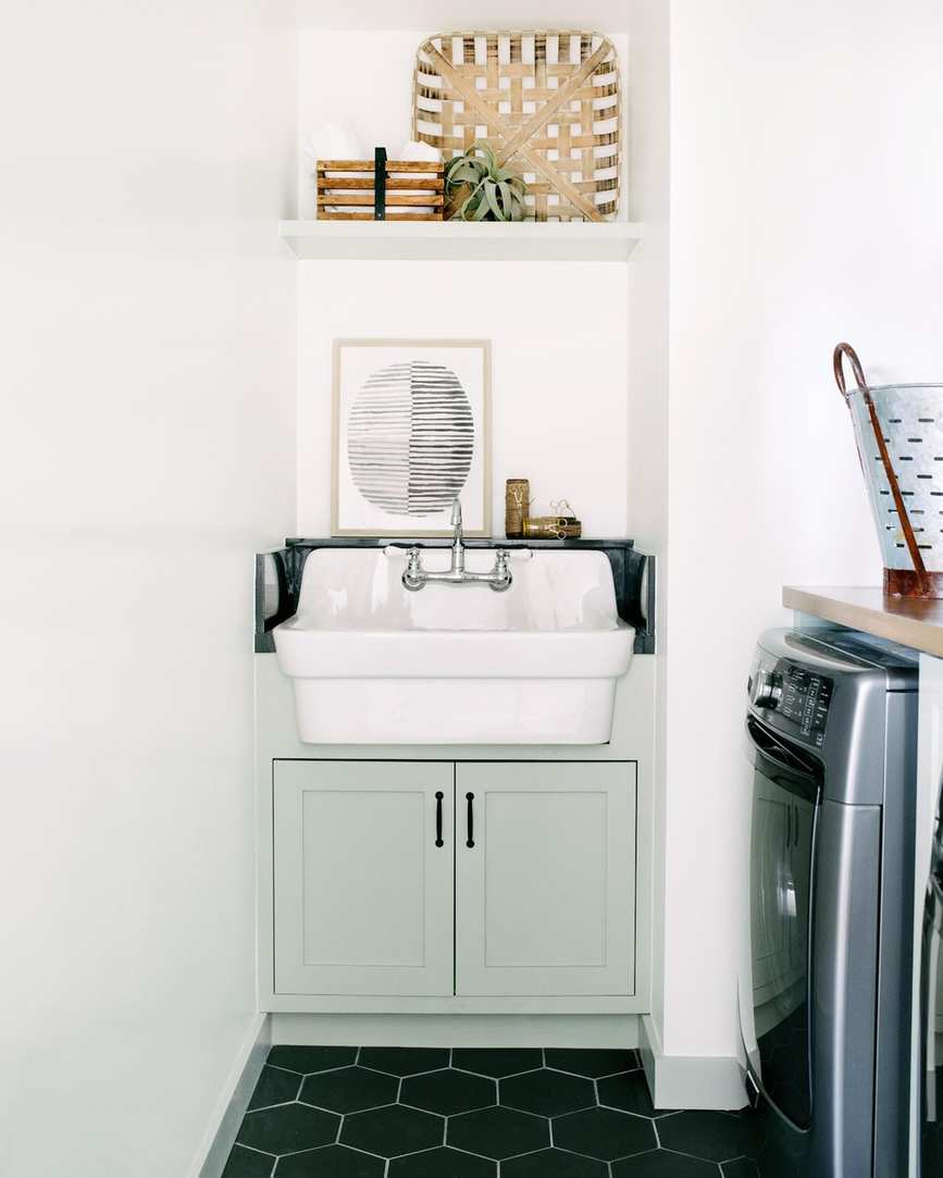Laundry room with corner cabinet and sink