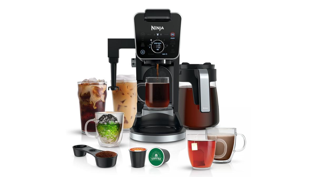 A Ninja DualBrew Pro against a white background with a range of different coffees
