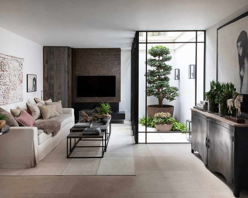Modern living room with wood wall paneling and TV