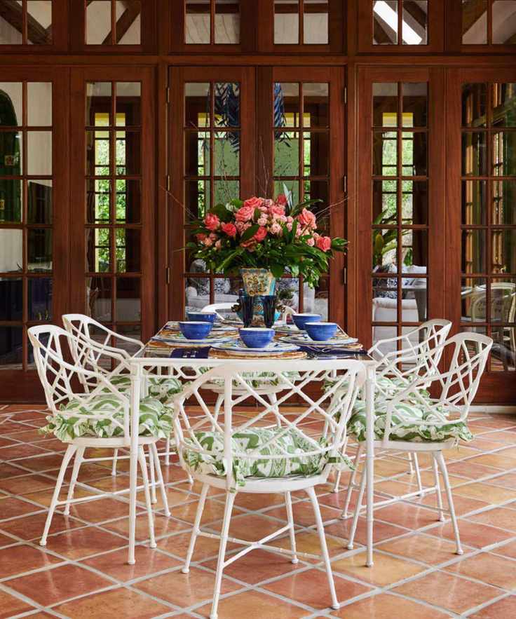 Charming outdoor patio setup with vintage dining set