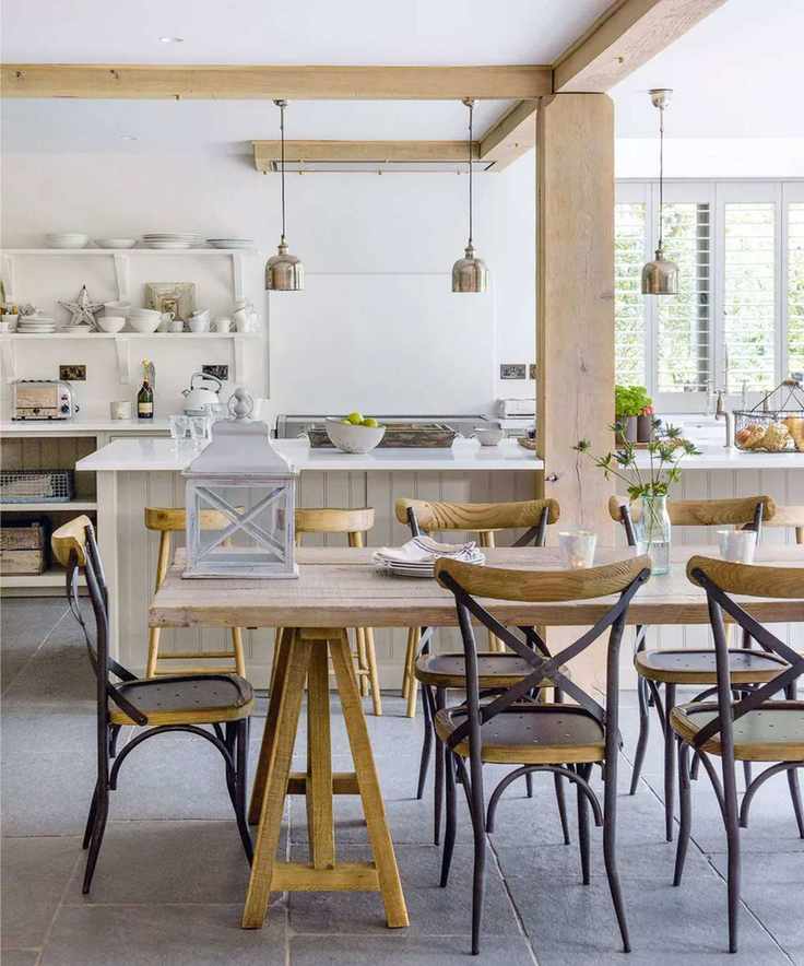 Spacious kitchen with wooden beams and a large dining table