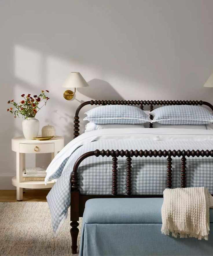 coastal bedroom by serena and lily with bobbin black bed frame and blue gingham bed linens