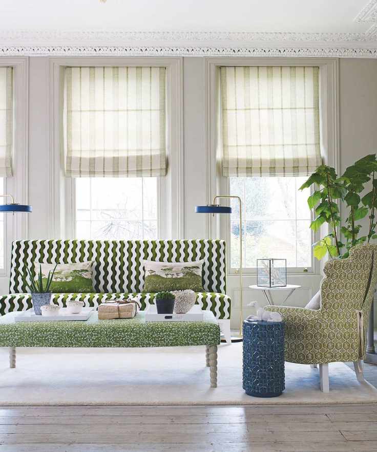 A bright living room with large windows and stylish decor