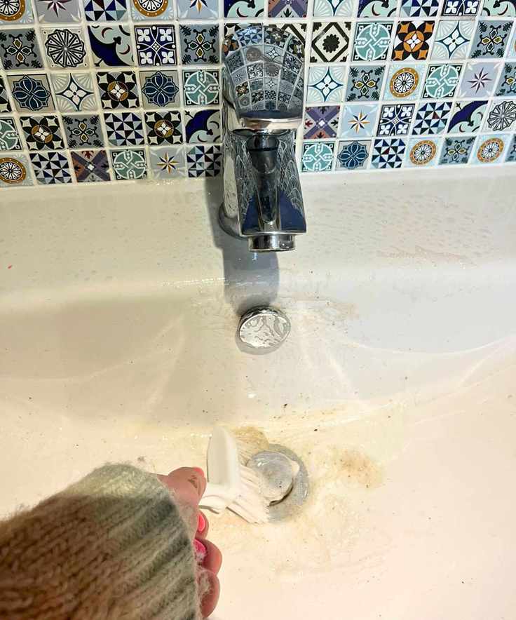 Lots of dirt coming out of sink drain after using a scrubbing brush