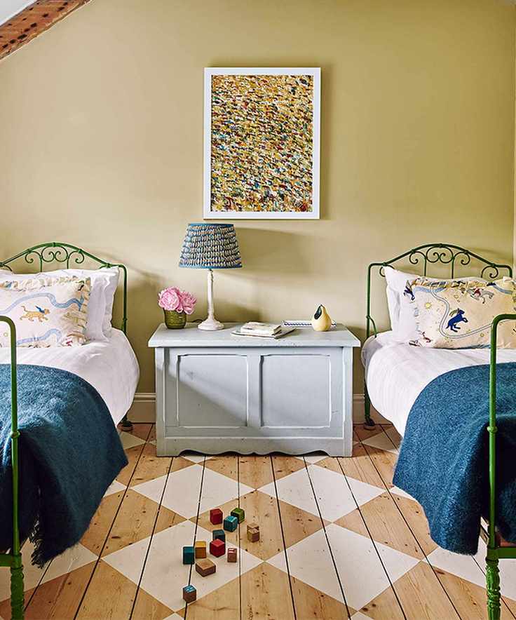 Bedroom with painted checkerboard floor and single beds
