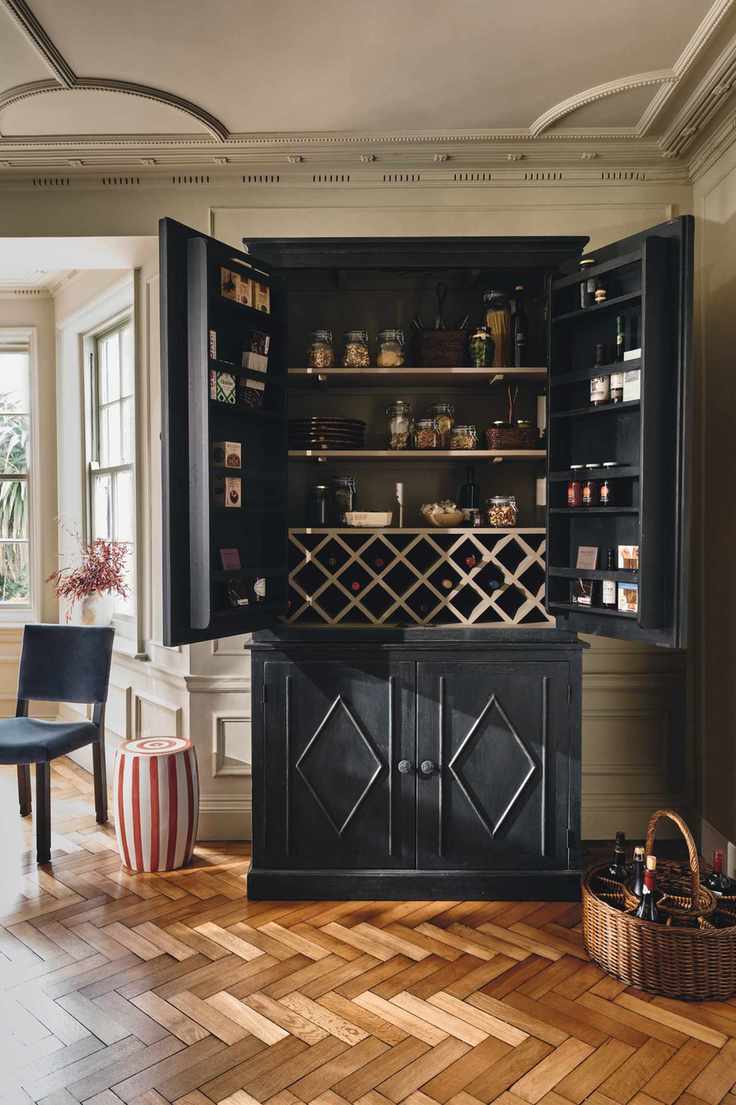 freestanding kitchen storage with integrated wine rack and spice jars