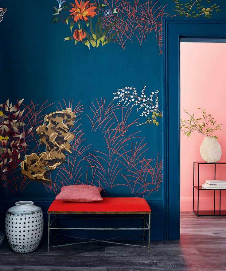 Hallway with bold dark blue floral wallpaper