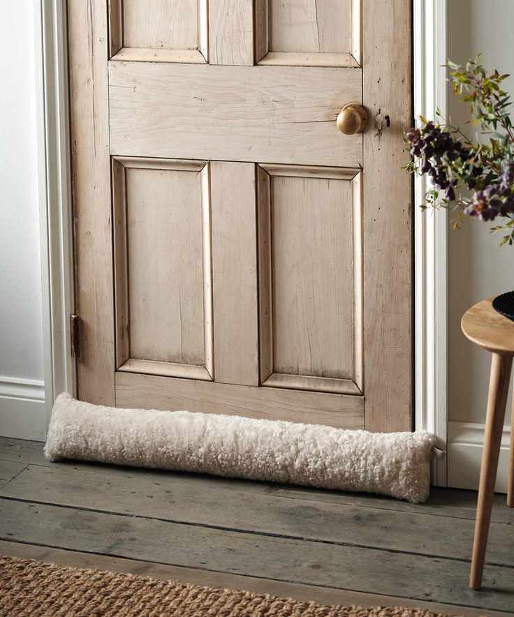Wooden door with draft stopper