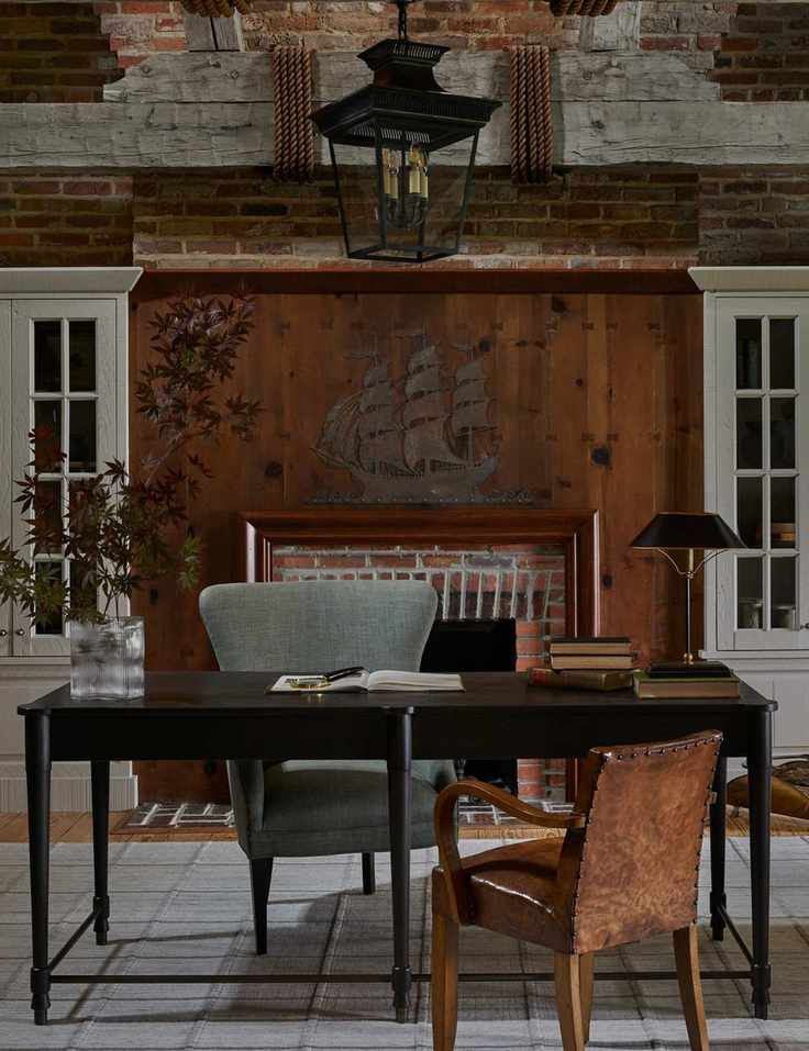 Nautical-themed workspace with brick accents and dark wood