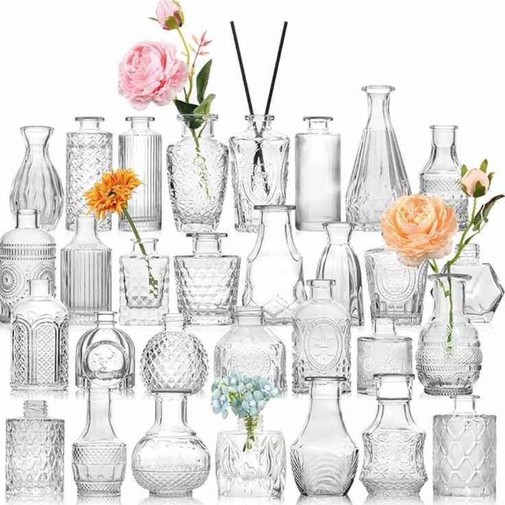 collection of clear glass etched bud vases