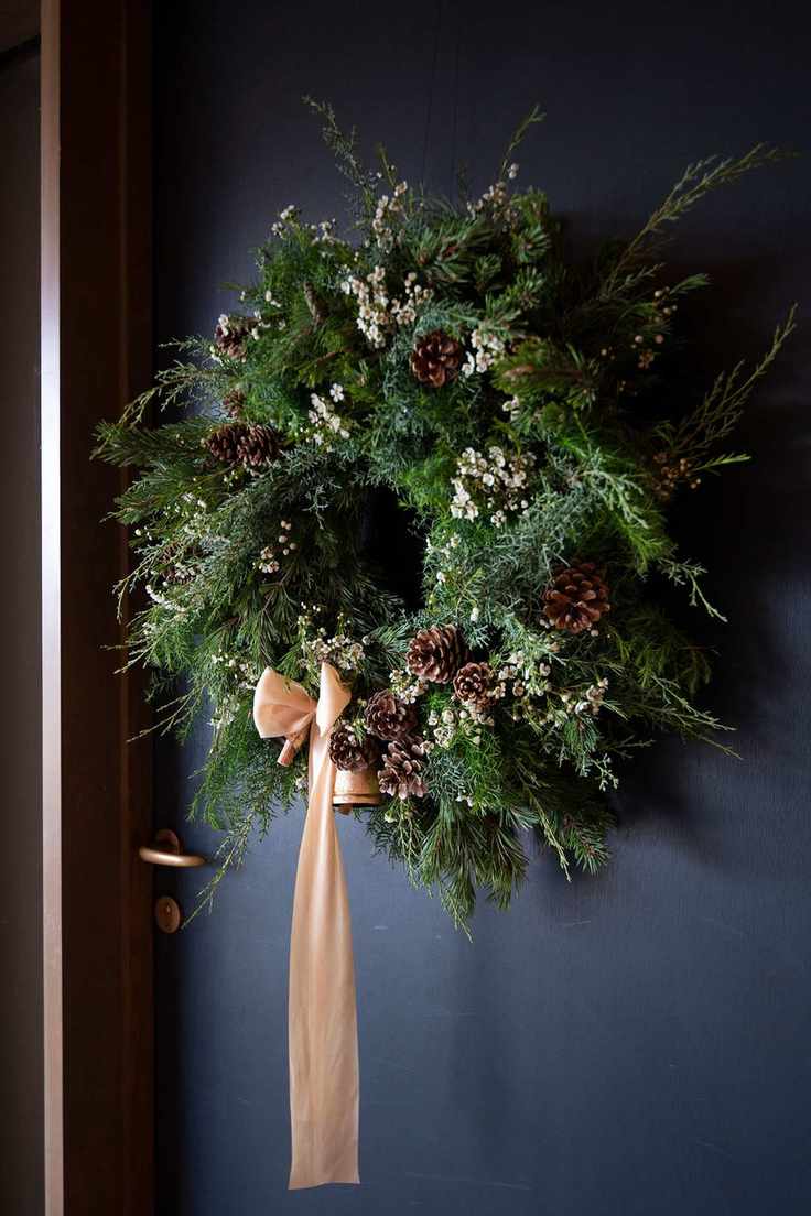 Freshly made Christmas wreath with pine cones
