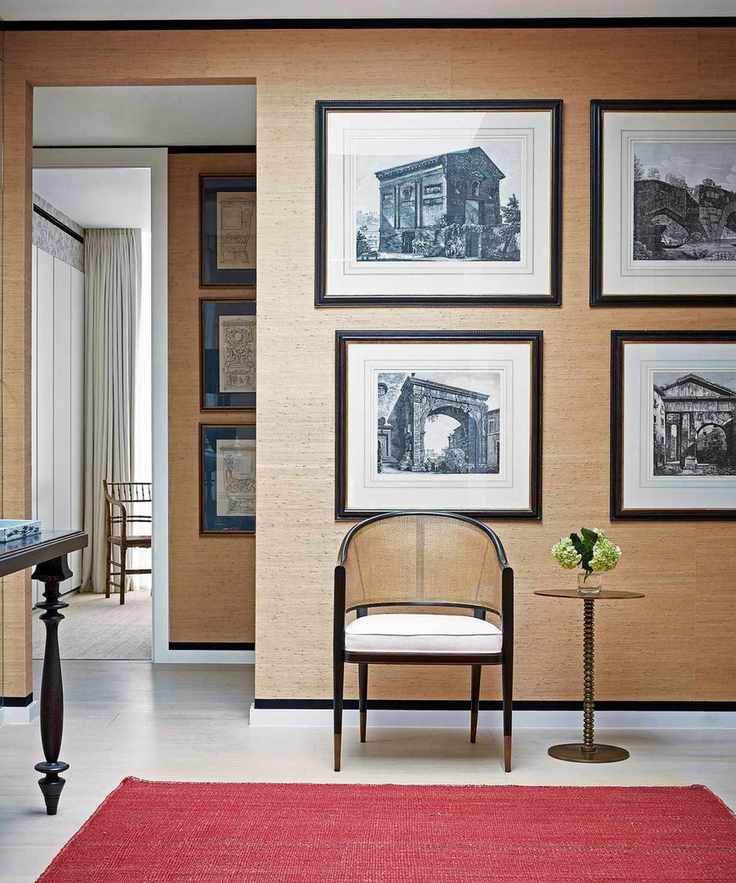 Hallway featuring red rug and decor elements