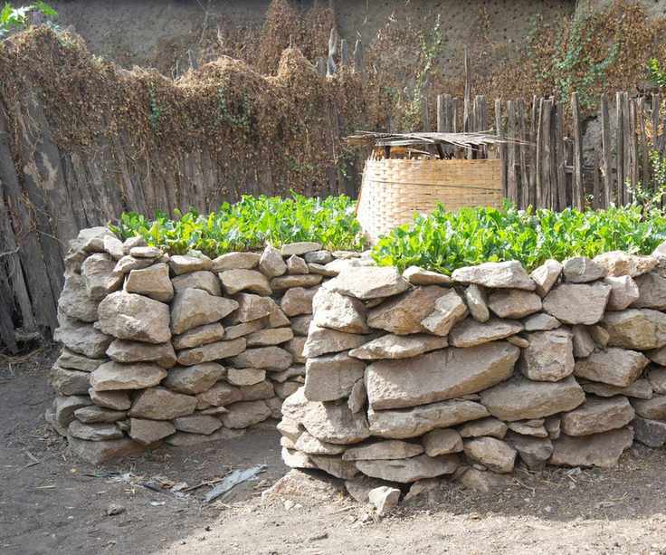 Raised keyhole garden made from stone