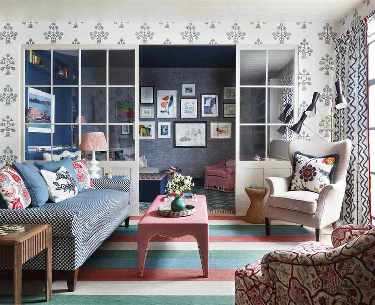 colorful living room with glass partition and striped rug