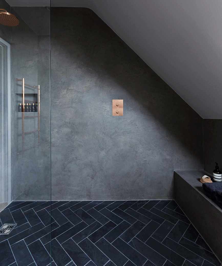 Wet room with grey walls and sloping ceiling