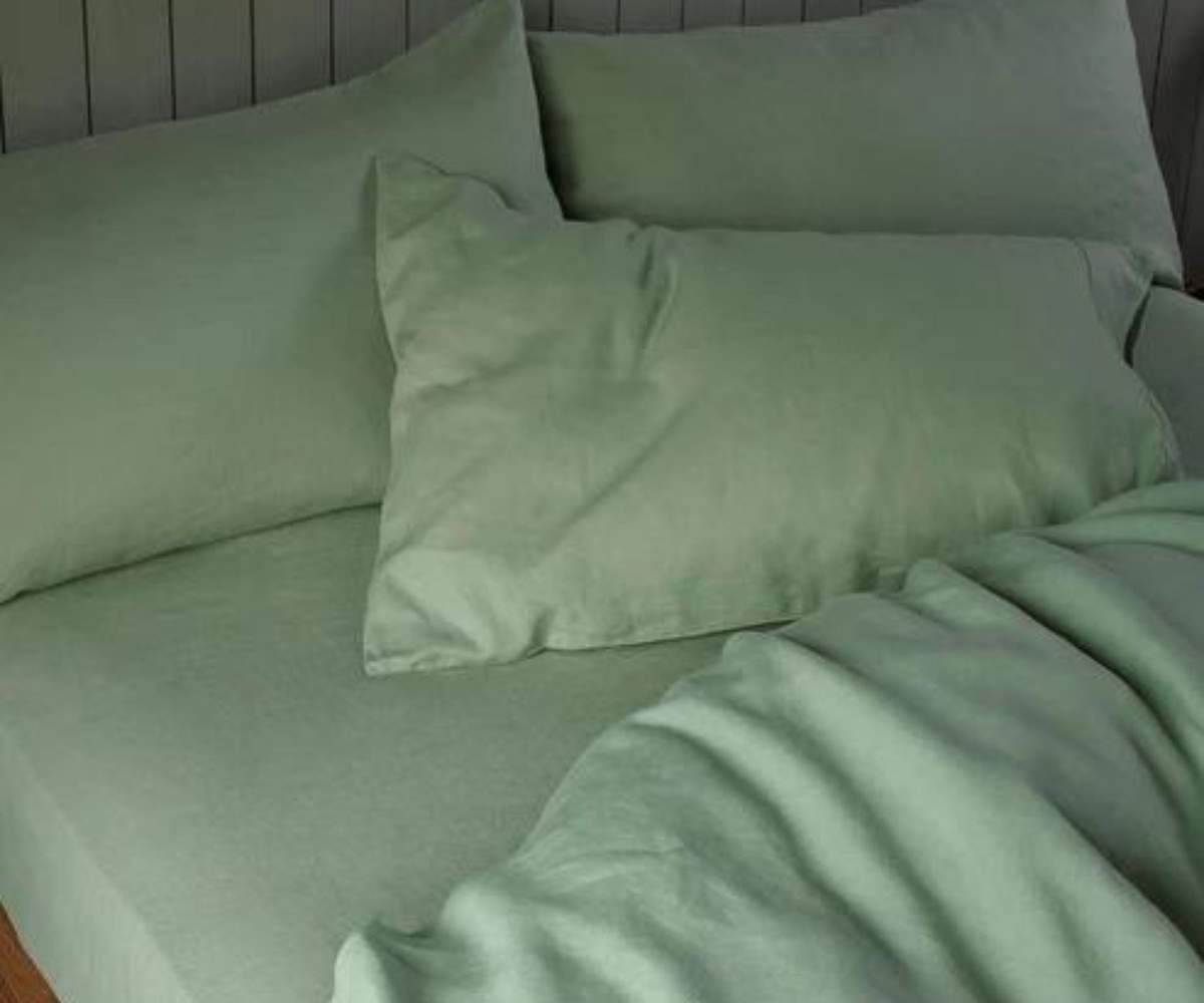Close up on a Piglet in Bed Sage Green Fitted Sheet.
