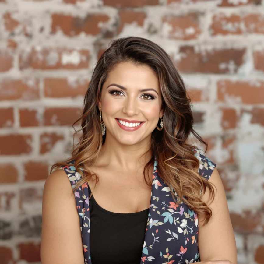 Sofia Martinez is a smiling woman with brunette hair and wears a floral top