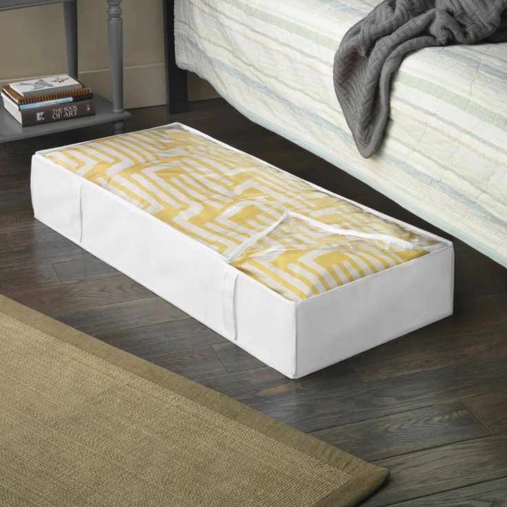 White Underbed storage bin with a clear lid, filled with white and yellow patterned fabric.