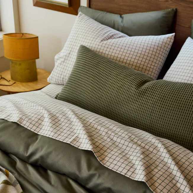 Green and white striped bedding