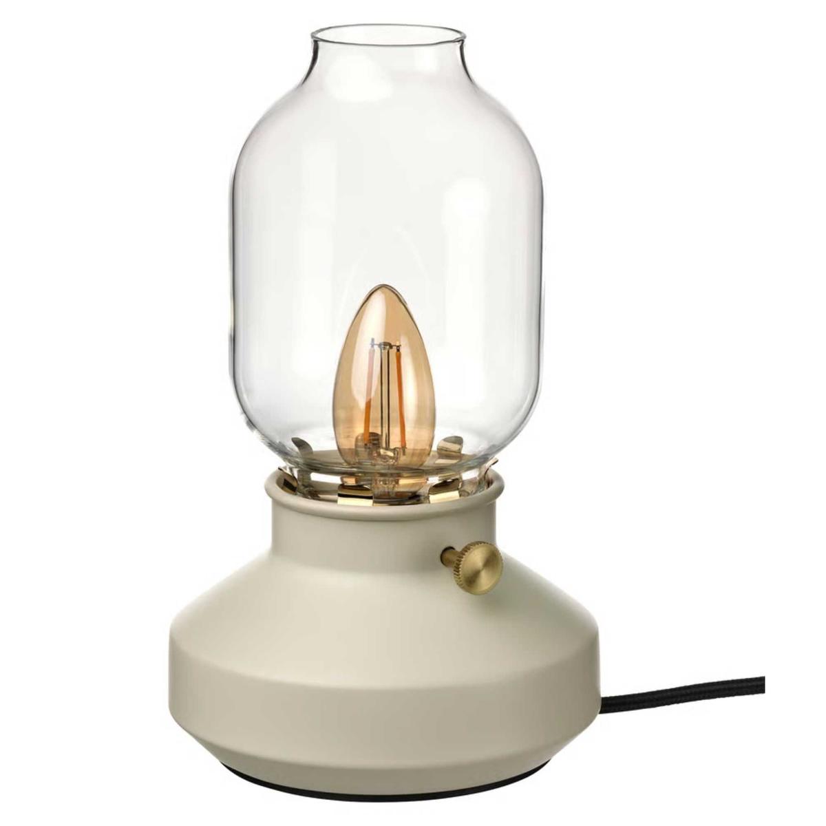 A cream colored IKEA TÄRNABY dimmable table lamp