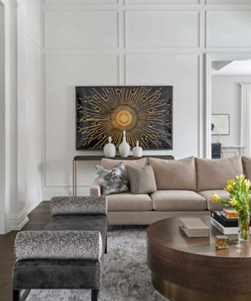 A white living room with a beige couch