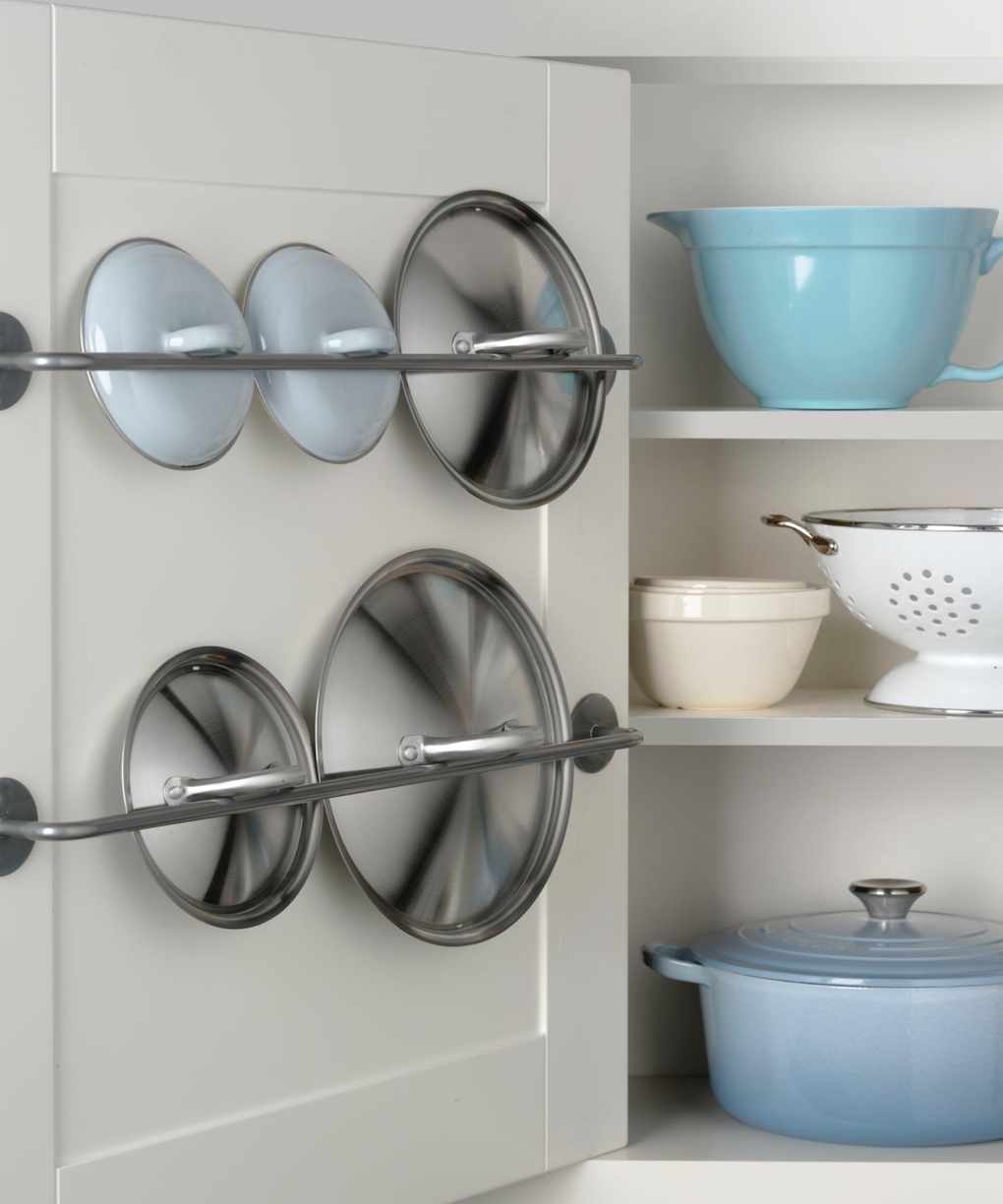 Metal rail on cabinet door for lids