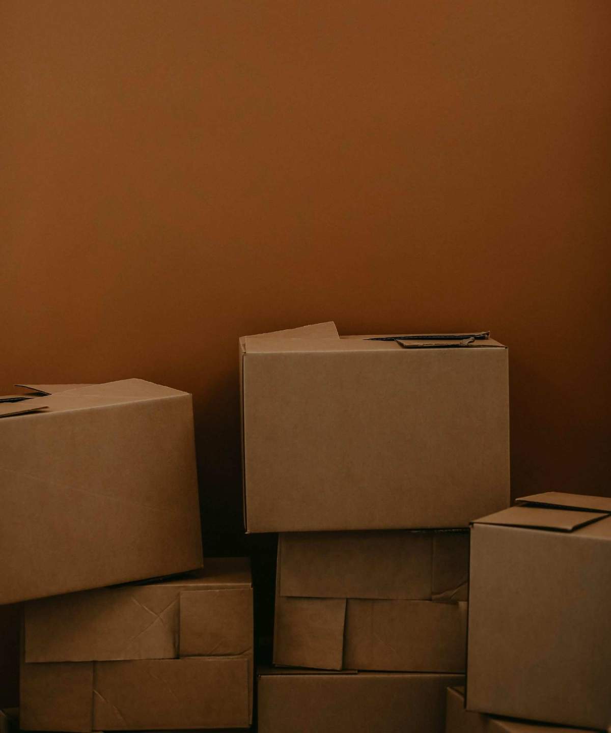 Moving boxes against a wall