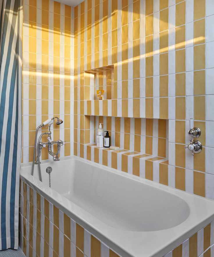 bathroom with yellow and white stripe tiles