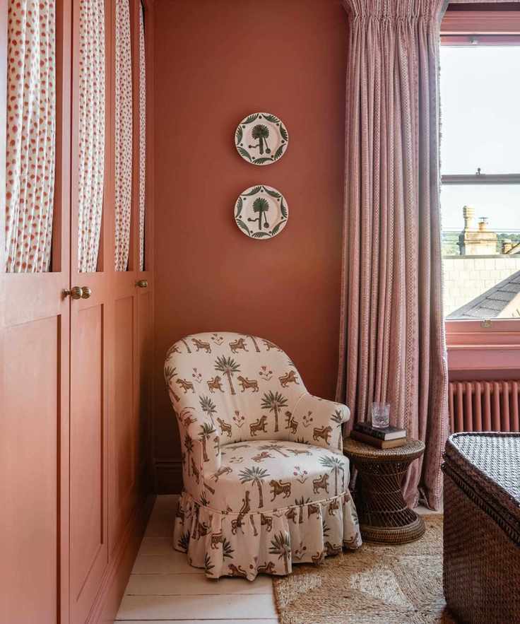 small orange bedroom with painted wardrobes