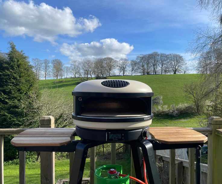 Gozney Arc unboxed and set up in front of a field