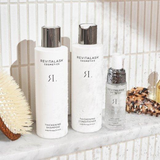 Image of Revitalash Thickening Shampoo, Revitalash Thickening Conditioner, and Revitalash Volume Enhancing Foam bottles