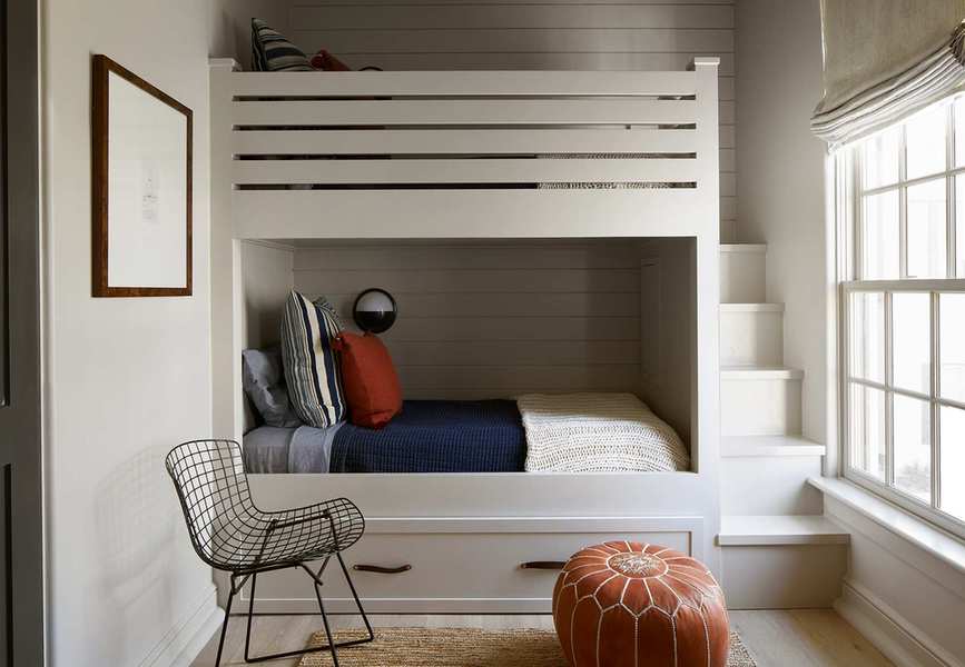 Bedroom with bunk beds and shiplap bedroom wall paneling