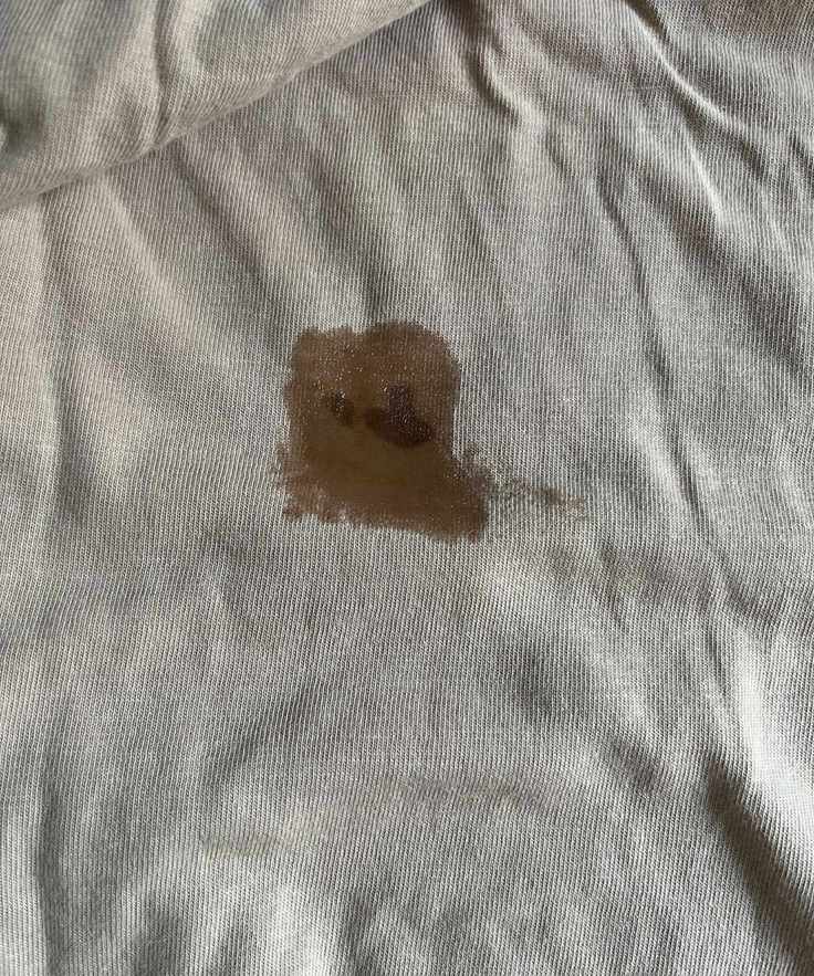 A wet patch over some old blood stains on a beige top