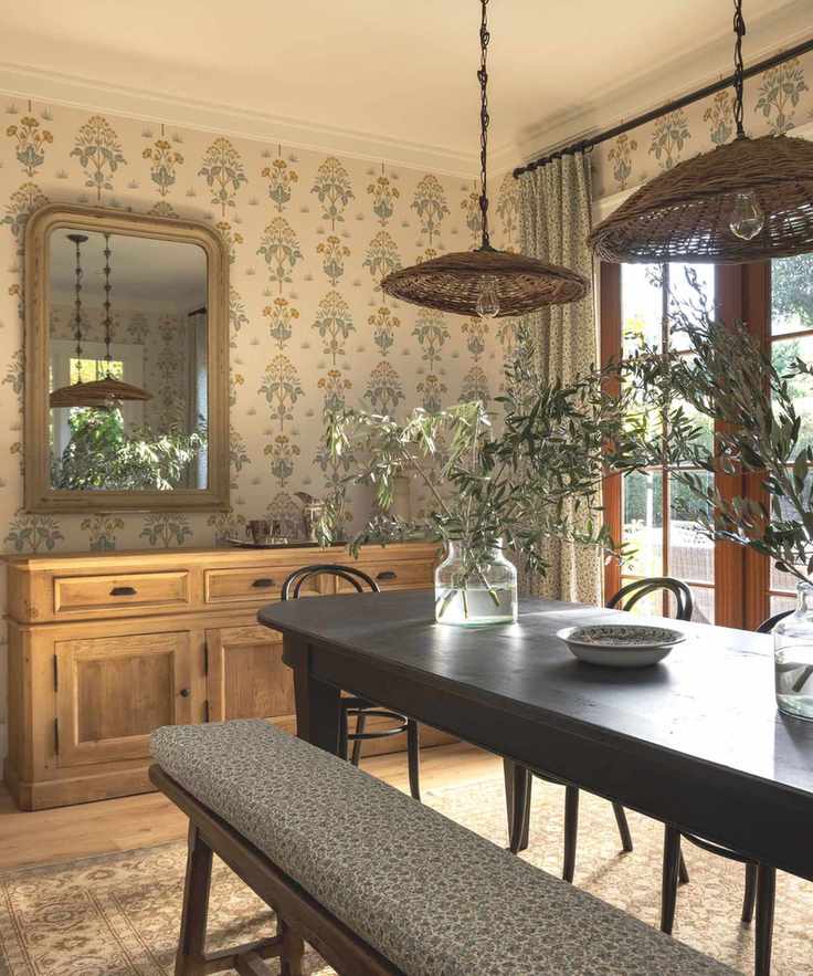 dining room with bench and wallpaper soft colors and wooden floors with glass doors to garden