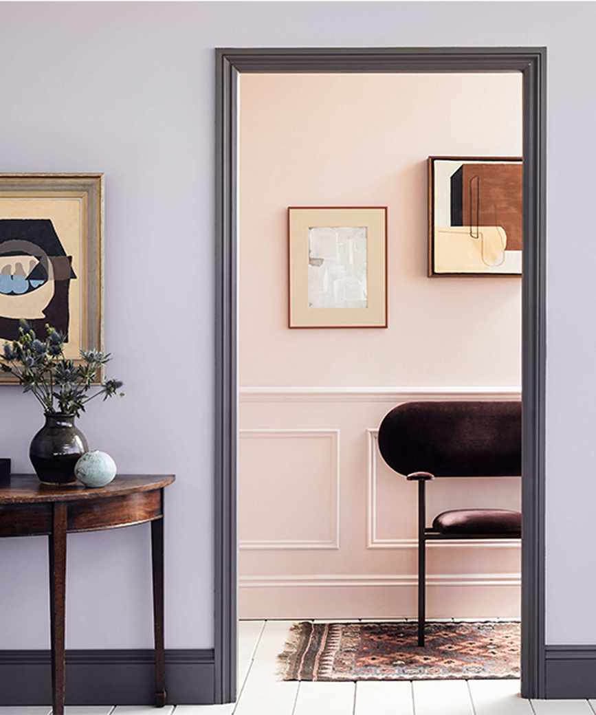 lilac hallway with grey woodwork and pink panelled adjoining room