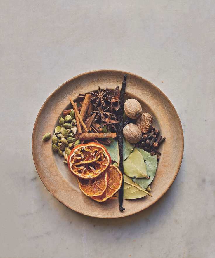 Brown bowl with spices, oranges