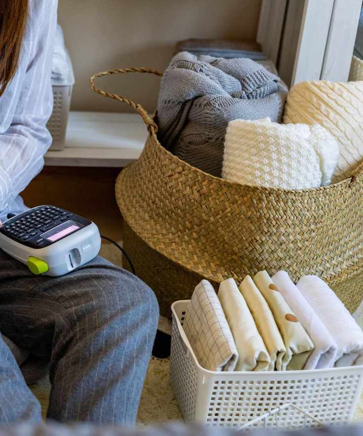 A woman organizing boxes using stickers